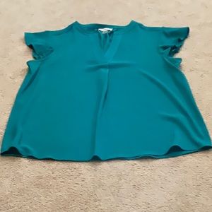 Calvin Klein woman’s cap sleeve blouse.  Size small. Color is teal.